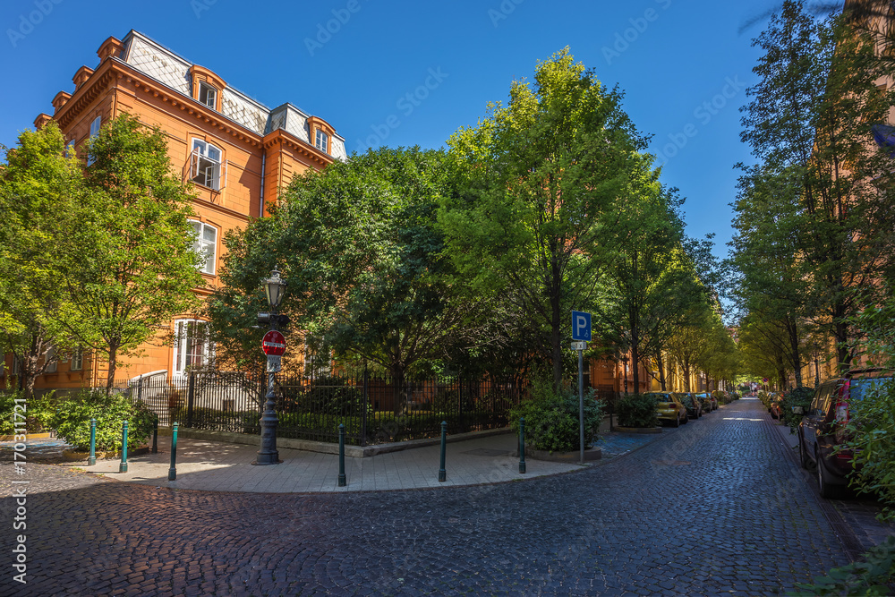 Budapest, Hungary - Panoramic view of the famous Reviczky street in Budapest in the morning with trees and clear blue sky