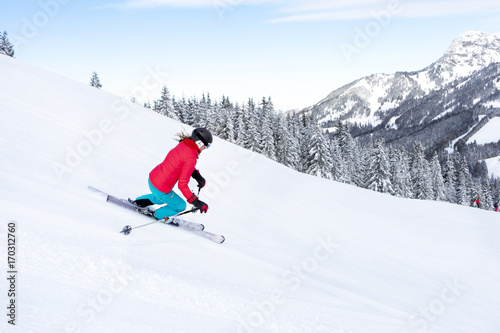 Ski holiday, Woman skiing downhill, Sudelfeld, Bavaria, Germany