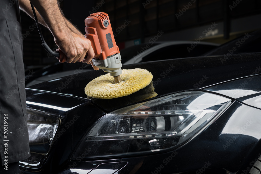 Φωτογραφία Car detailing series: Closeup of polishing black car