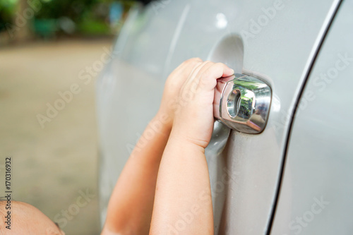 Wallpaper Mural Asian toddler girl hand is on car's door - young kid opening door of car Torontodigital.ca