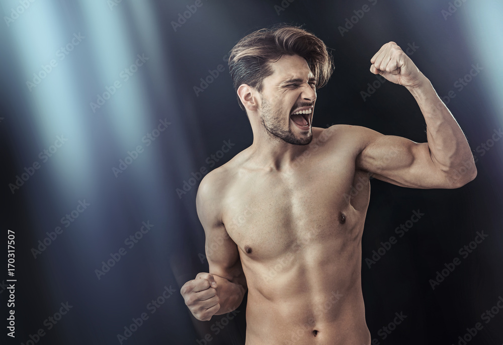Portrait of a victorious muscular man