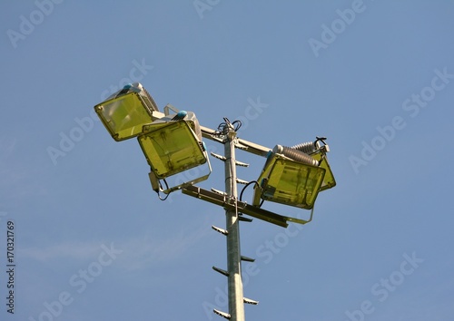 Floodlight soccer close up photo behind blue sky photo