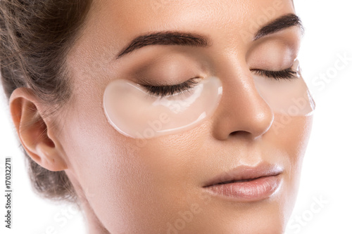 Tableau sur toile Woman with collagen pads under her eyes