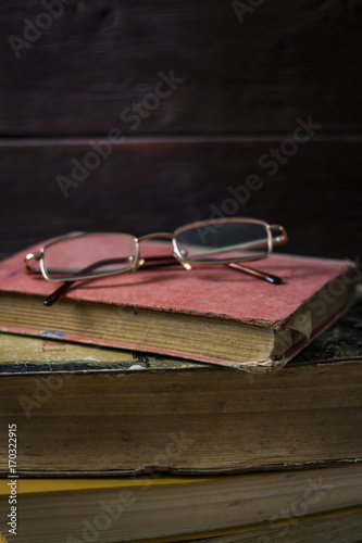 Beautifully folded old books and glasses from above
