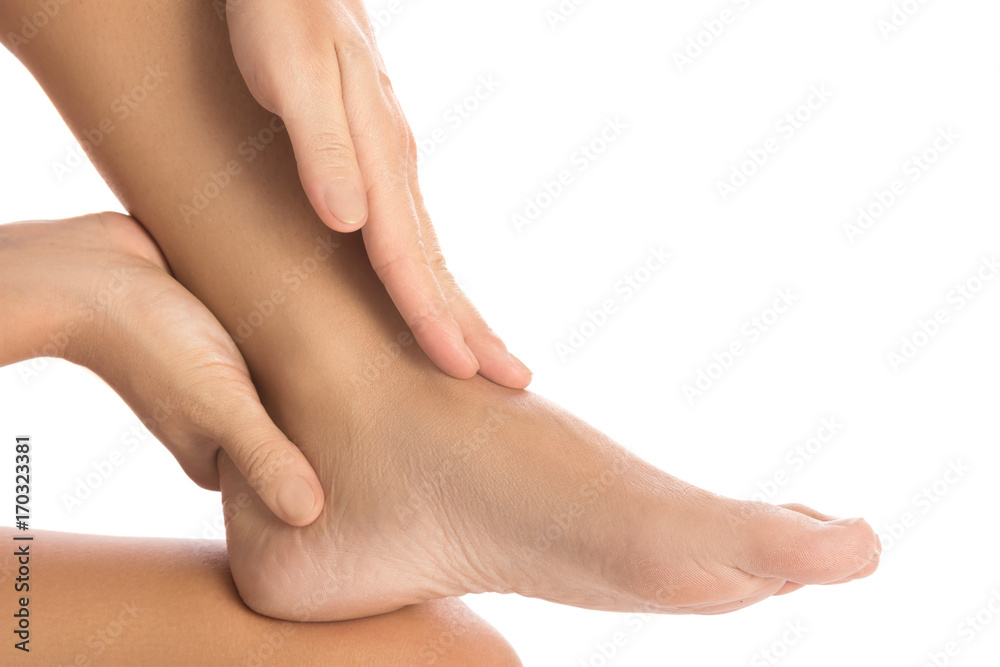 Woman is touching her injured ankle Woman is touching her injured ankle