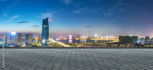 Canvas Print modern buildings near shanghai at night from empty floor