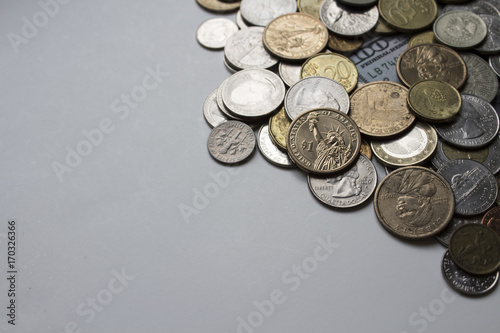 Beautiful image of coins of different countries on a white background under natural light. Can be used as a postcard