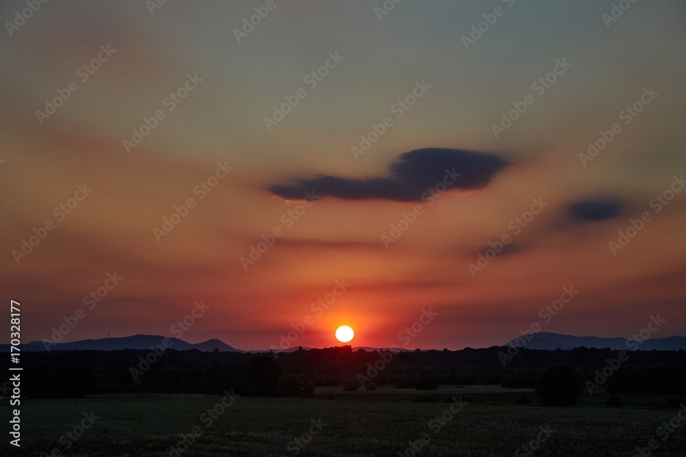 Sunset with distant landscape