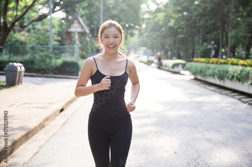 Young asian lady exercise outdoor © kapturephoto