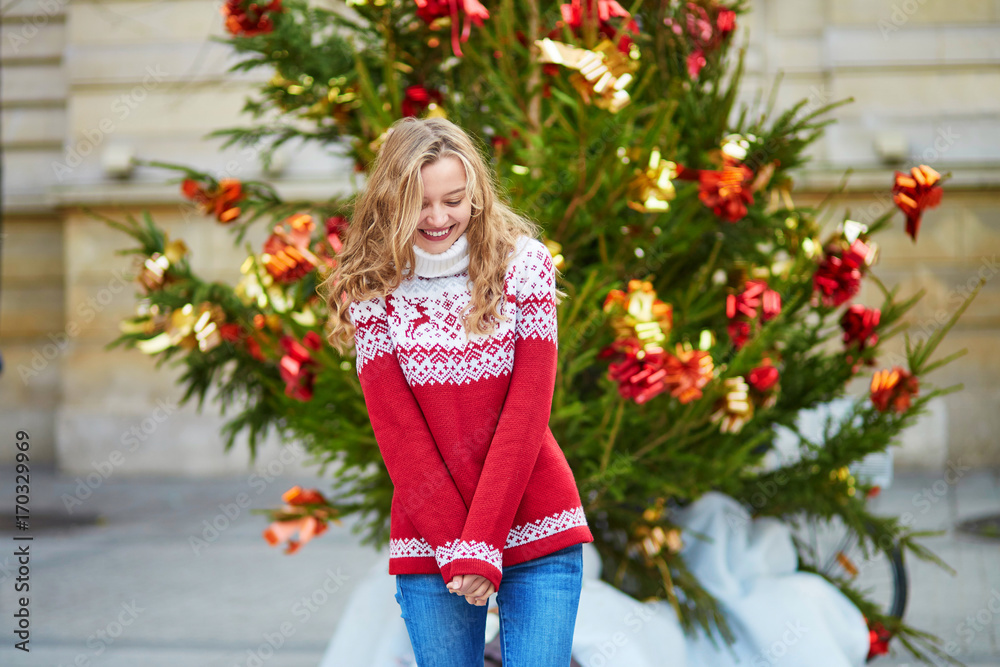 Girl with a brightly decorated Christmas tree Girl with a brightly decorated Christmas tree