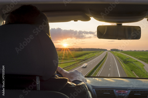 view from the inside of a car driving a busy highway, view from the driver's position
