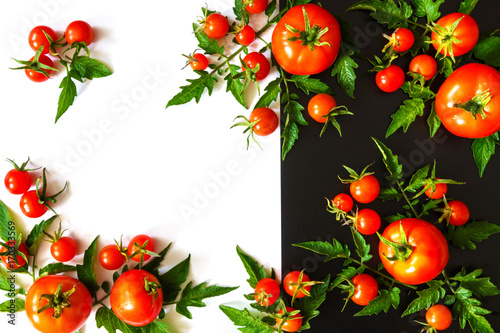 Fresh juicy tomatoes, cherry and leaves pattern and ornament on a white black background with copy space flat view from above and place for text isolates