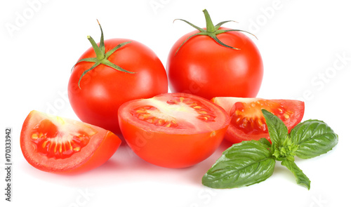 tomato with basil leaf isolated on white background