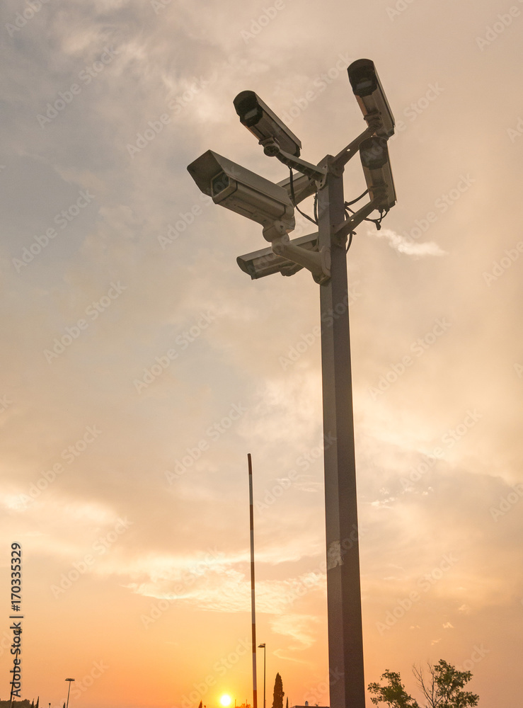 Six cctv security cameras on the street pylon. Security cameras mounting on the high top position