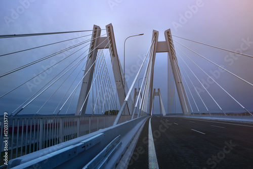 Modern Macharski bridge in Cracow in the evening photo