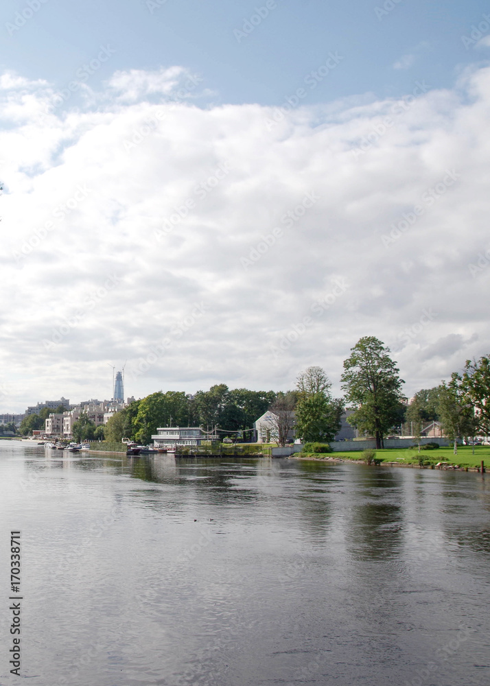A quiet harbor. Summer view of the embankment overlooking the park. A quiet harbor. Summer view of the embankment overlooking the park.