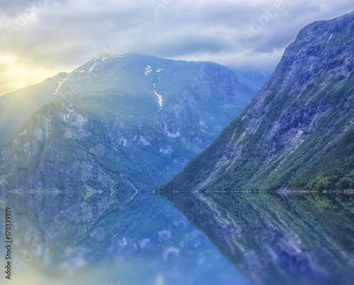 beautiful and dramatic Norway landscape with mountains and sea in fjord
