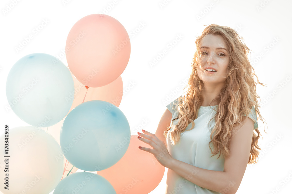 beautiful woman with flying multicolored balloons beautiful woman with flying multicolored balloons
