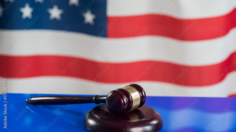 Law symbols on USA flag background.