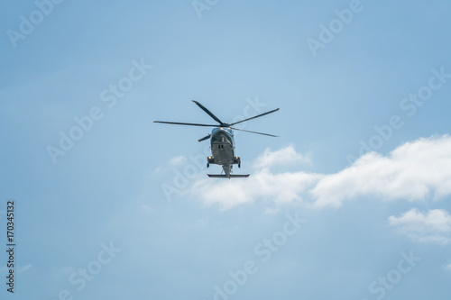Fototapeta Naklejka Na Ścianę i Meble -  The helicopter is flying in the sky