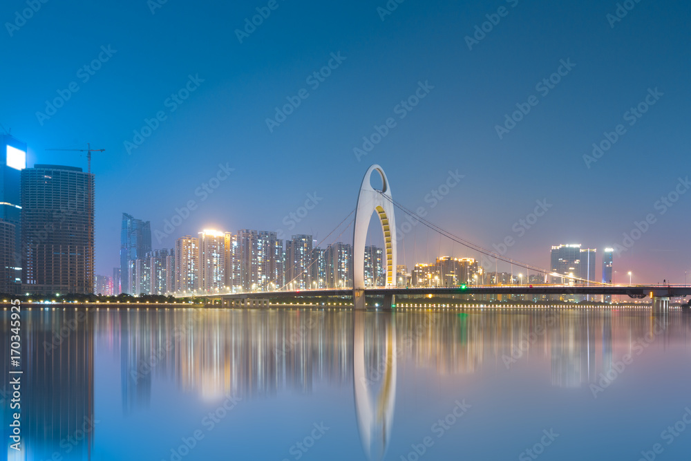 city skyline and reflection in guangzhou , beautiful pearl river new town at daytime ,China