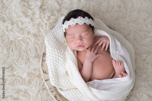 Newborn Girl Wearing a Lace and Pearl Headband