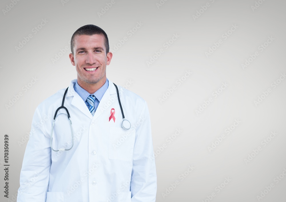 Doctor man with breast cancer awareness ribbon Doctor man with breast cancer awareness ribbon