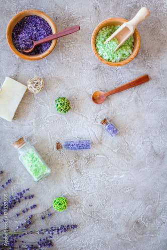 bath salt in herbal cosmetic with lavender on stone desk background top view space for text