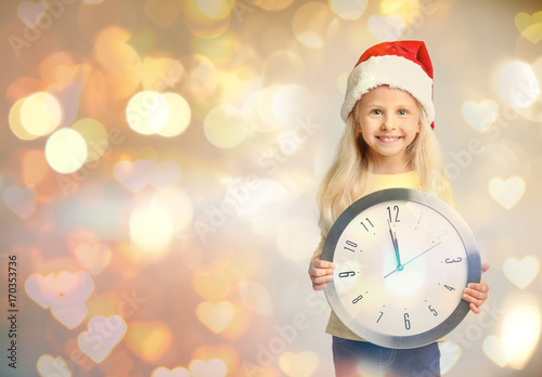 Cute little girl in Santa h...