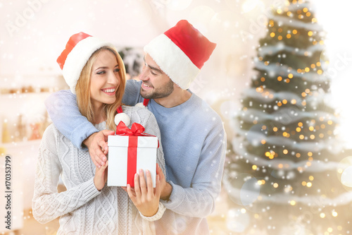 Happy couple in Santa hats ...