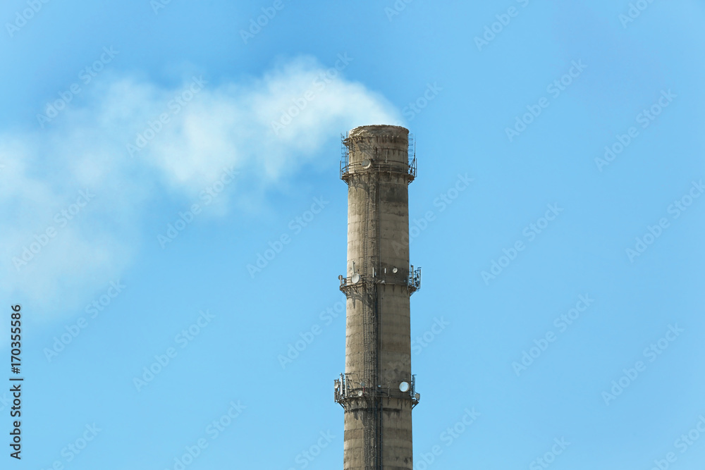 Flue of industrial factory on sky background Flue of industrial factory on sky background
