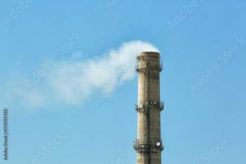 Flue of industrial factory on sky background