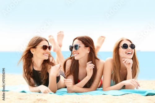 Beautiful young women lying...