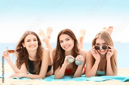 Beautiful young women lying...