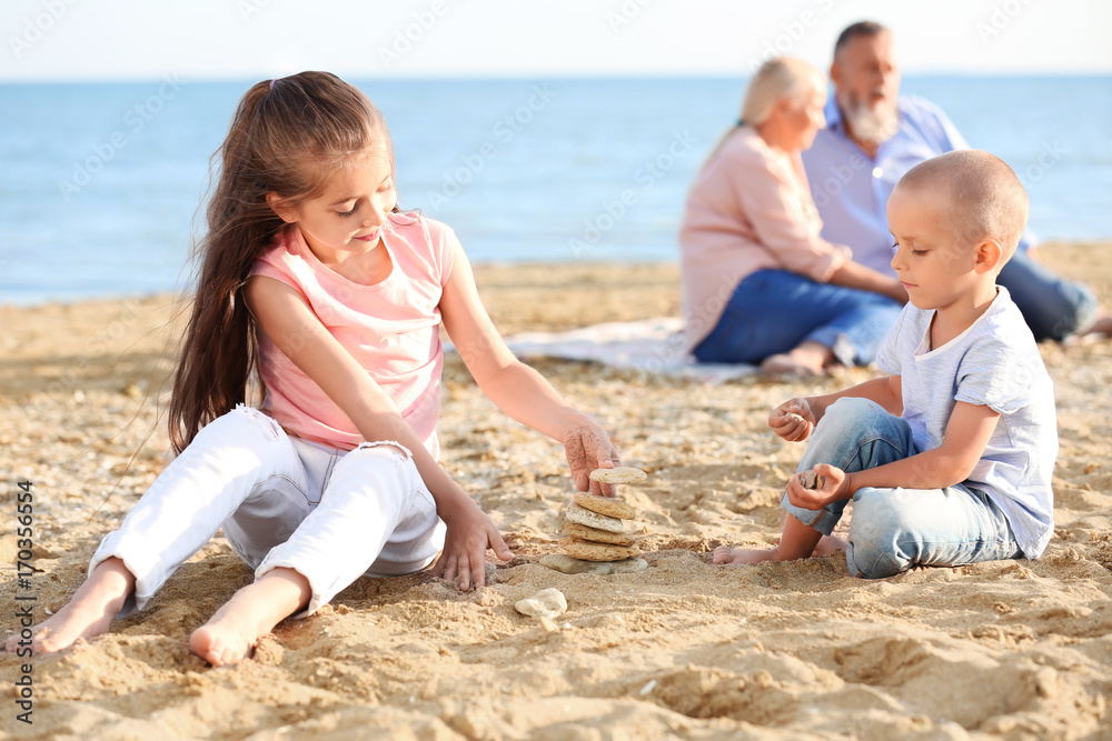 Cute children playing on sea beach Cute children playing on sea beach