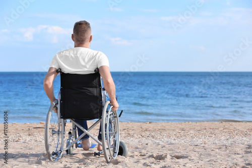 Elderly man in wheelchair o...