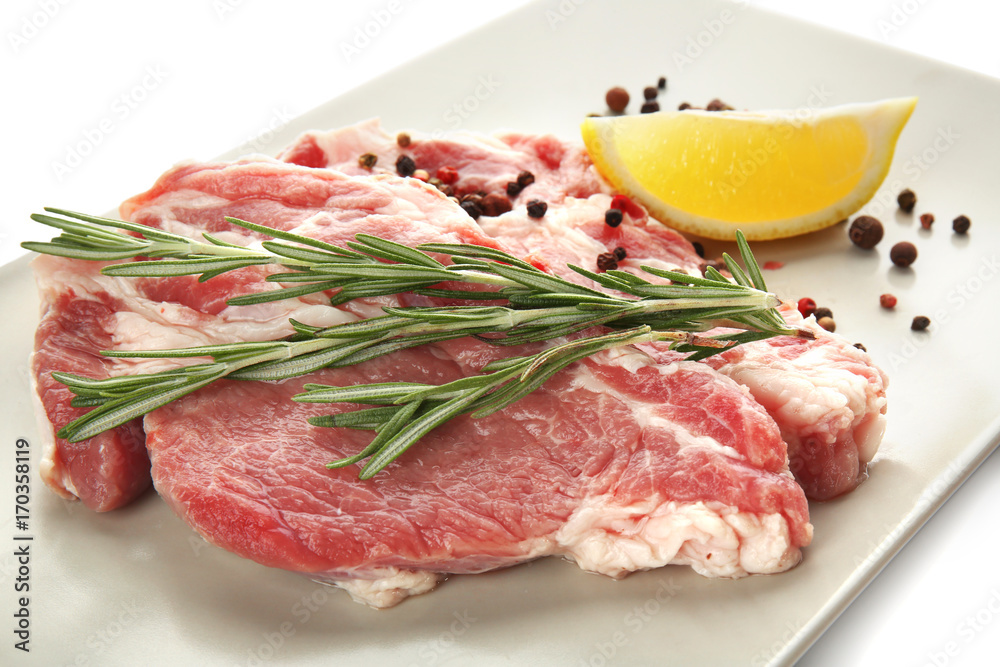 Plate with fresh raw meat, isolated on white
