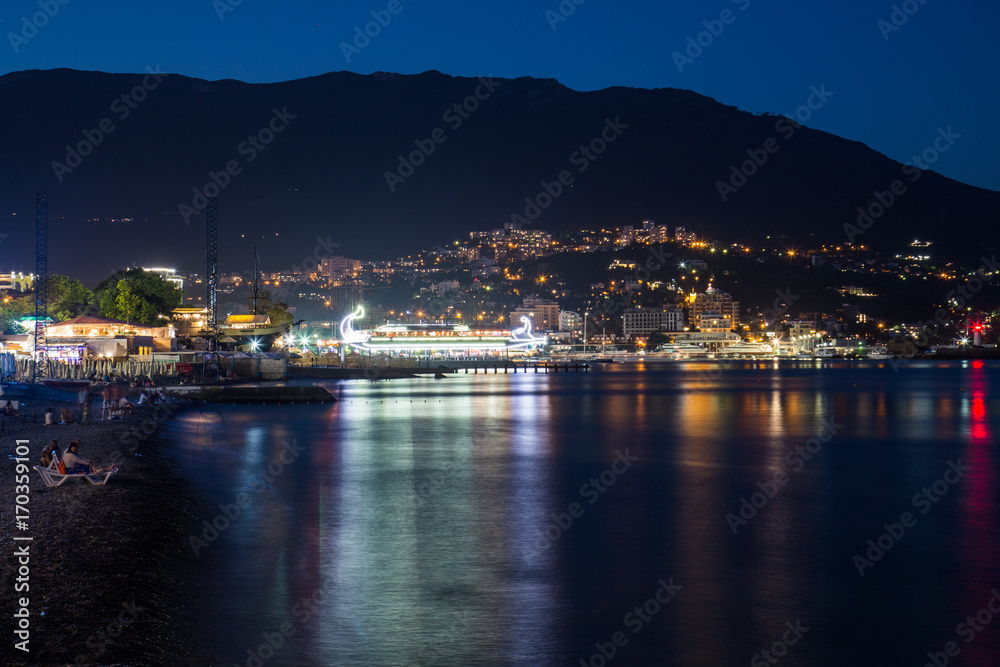 Scenic night panoramic view of Black Sea harbor and port in Yalta