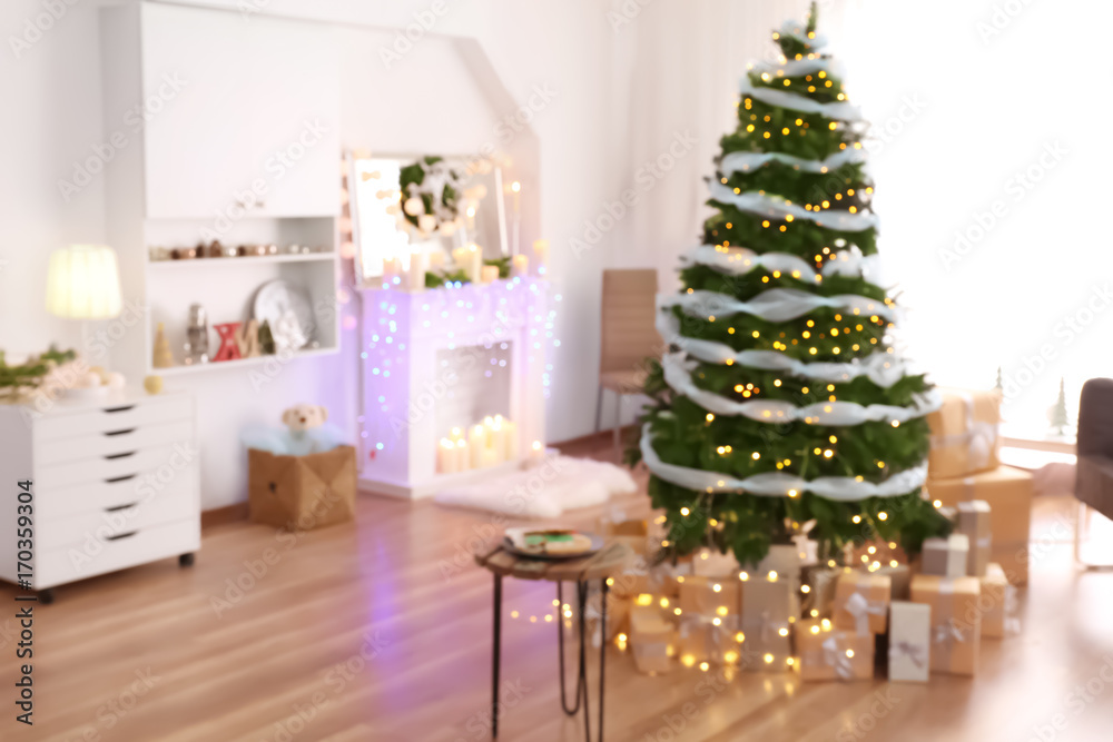 Blurred view of living room interior with beautiful Christmas tree