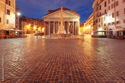 The Pantheon, former Roman temple of all gods, now a church, and Fountain with obelisk at Piazza della Rotonda, at night, Rome, Italy