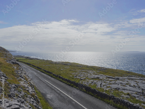 Road by Atlantic ocean  West coast of Ireland.