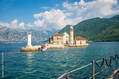 MONTENEGRO - JUNE 04/2017. Tourists sailed on a yacht to the island of Gospa od Skrpela in the Boka Bay of Kotor. photo