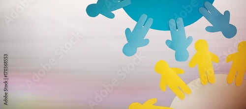 Composite image of yellow and blue little person on circle 