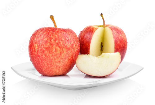apples in white plate on white background
