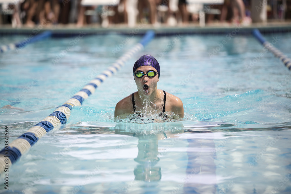 Young female swimmer during a swim meet
