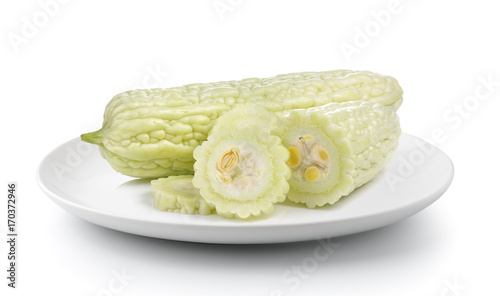 bitter melon in a plate isolated on a white background