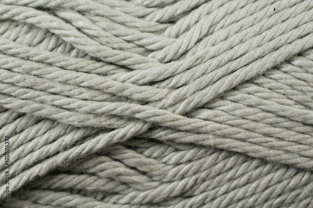 A super close up image of gray yarn
