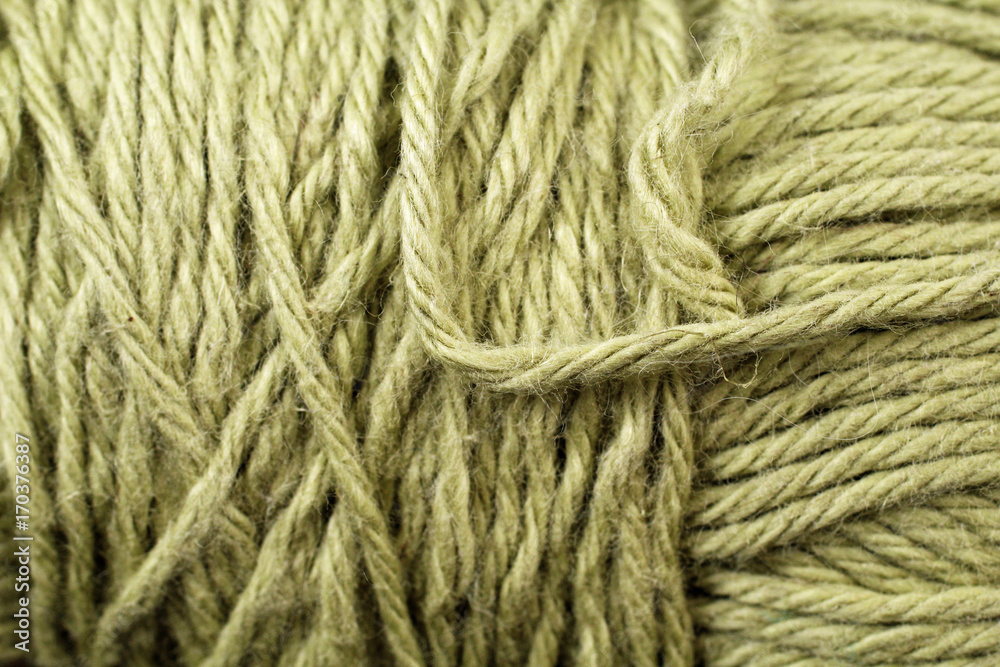 A super close up image of lime green yarn