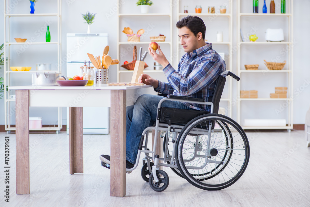 Disabled young man husband working in kitchen