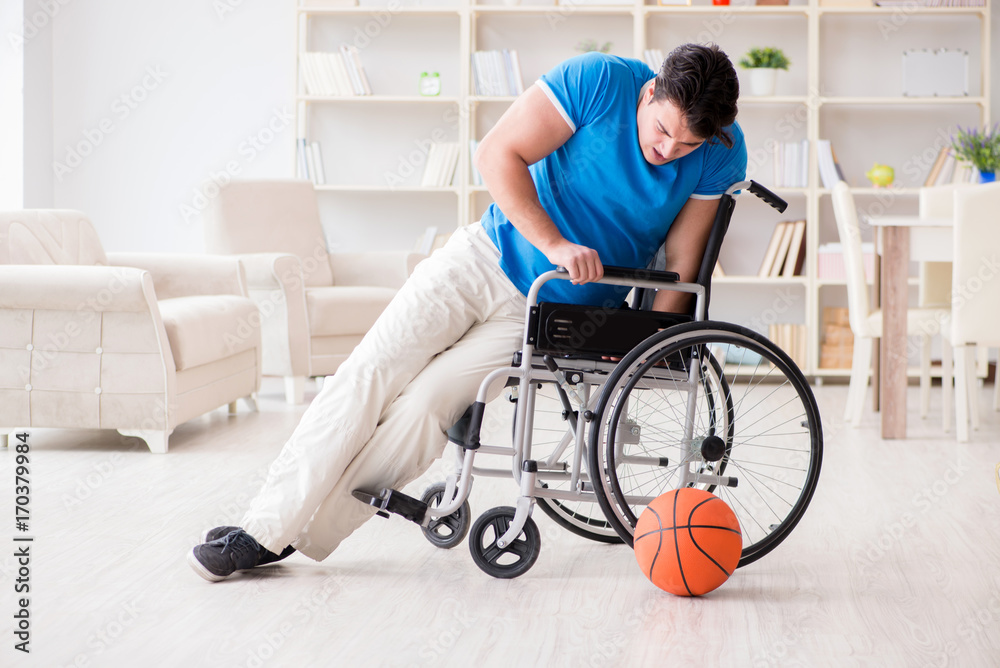 Young basketball player on wheelchair recovering from injury Young basketball player on wheelchair recovering from injury